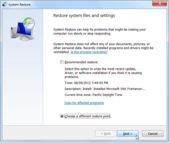 chọn Choose a different restore point